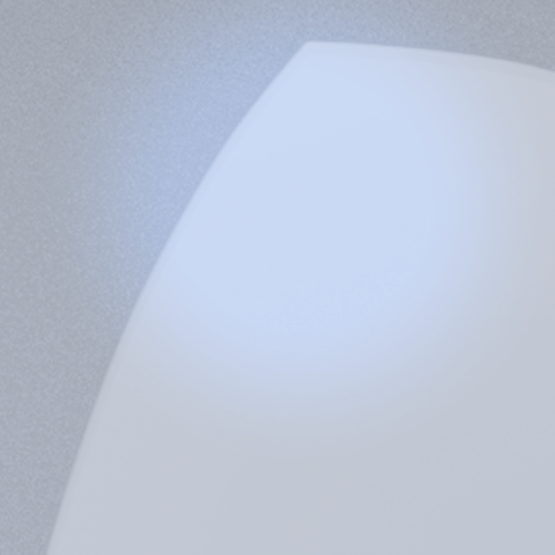 A close-up of a blue light lens on a white surface, showing its clarity and reflective quality.